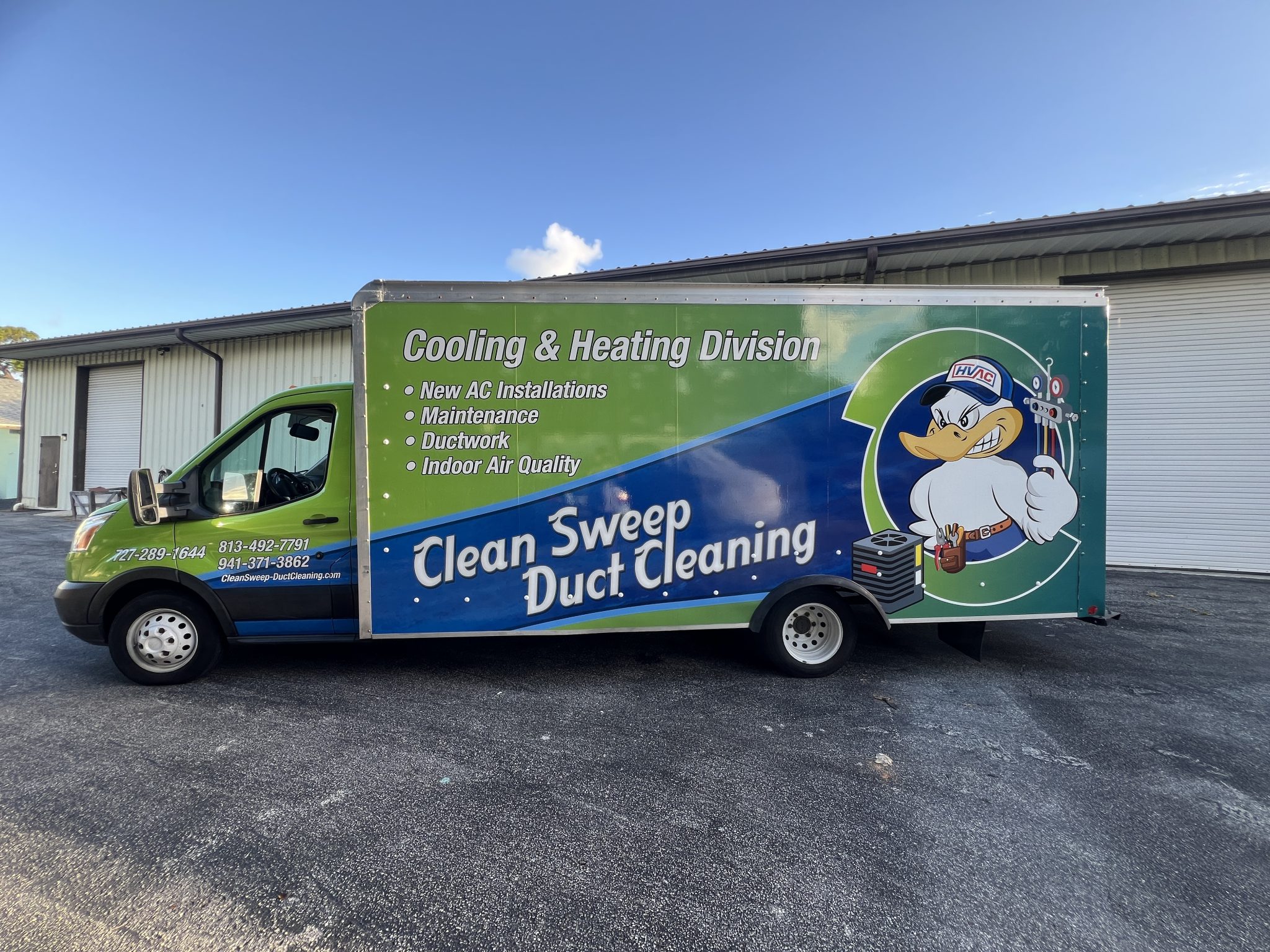 Custom full wrap on a commercial box truck featuring vibrant printed graphics for high-impact mobile advertising and brand visibility.