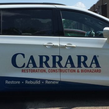 Custom vehicle wrap graphics on van for Carrara