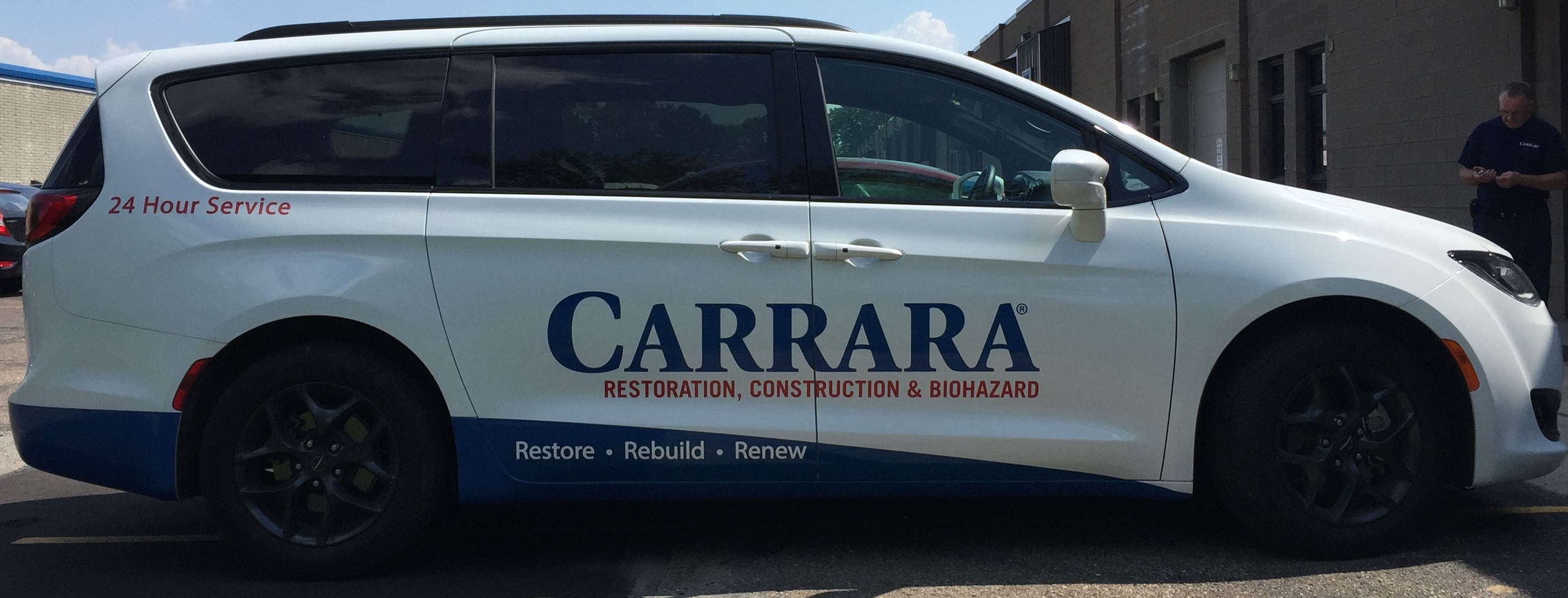 Custom vehicle wrap graphics on van for Carrara