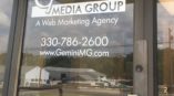 Gemini Media Group front door window sign
