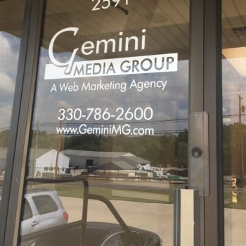 Gemini Media Group front door window sign