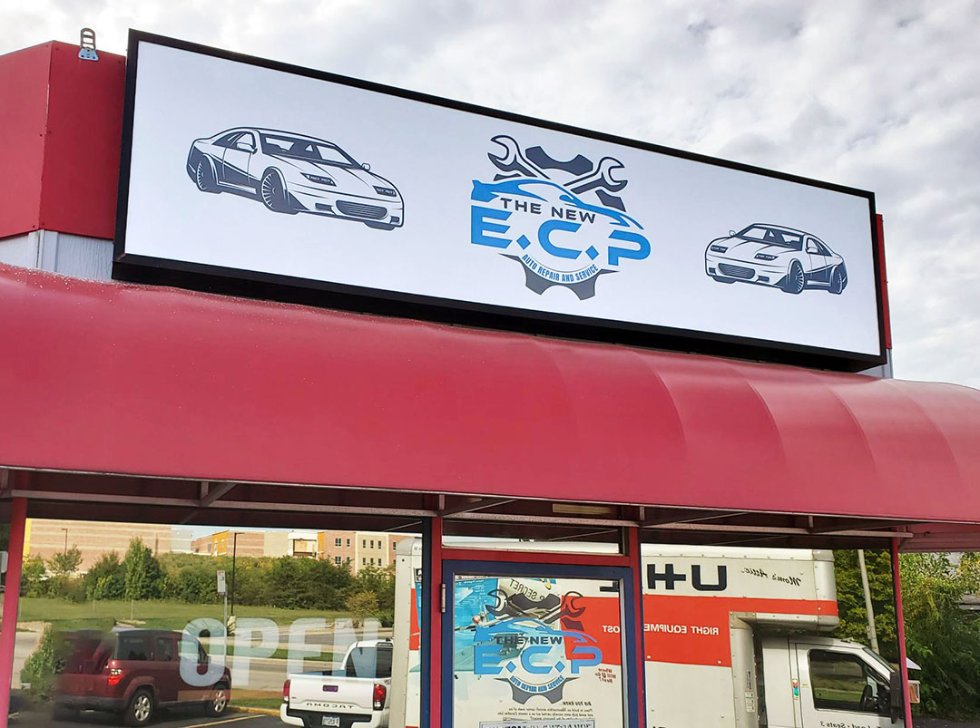 A large backlit sign installed on top of ECP Auto Repair in Cuyahoga Falls, Ohio.