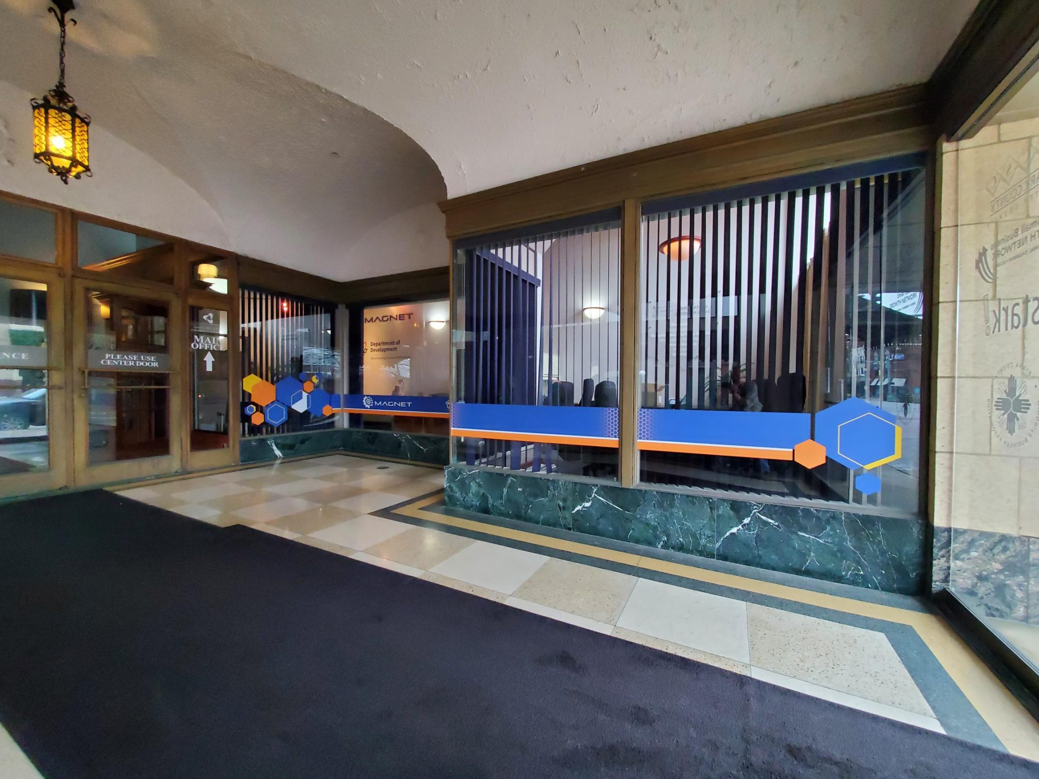 A photo of the MAGNET lobby showcasing window graphics application.
