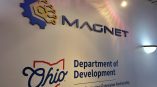 A photo of a dimensional sign depicting the MAGNET logo.