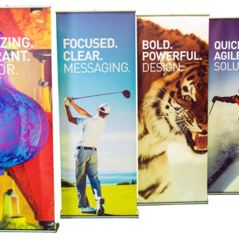 4 large retractable banner of man playing golf, a tiger, a colorful lamp, and man skiing