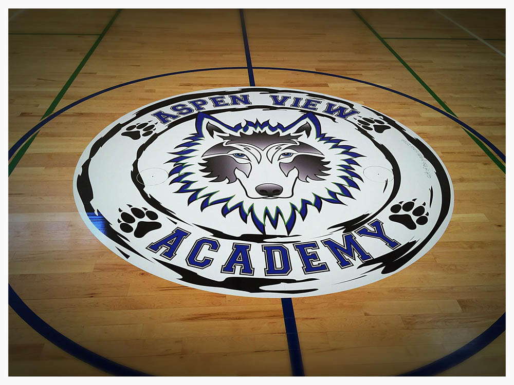 Colorful school logo floor graphic at Aspen View Academy