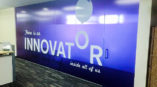 Glass etching inside an office with motivational quote on it 