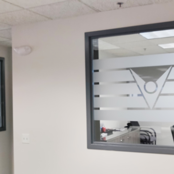 Glass etching of company logo in an office 