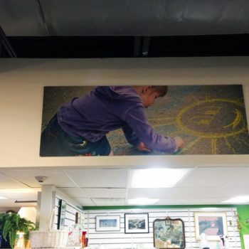 ceiling photograph of kid drawing printed and hung