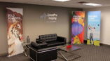 speedpro imaging office with 3 graphic standing banners