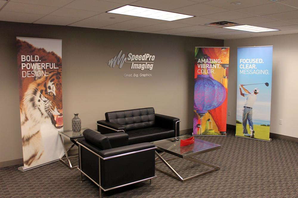 speedpro imaging office with 3 graphic standing banners