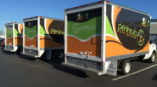 Box truck fleet wrapped in custom graphics for catering and events company