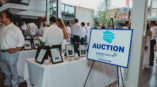 Crohn's & Colitis a night in white auction sign 