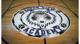 School Logo on gym floor of basketball court