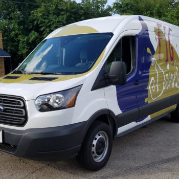Custom printed vehicle wrap for business van