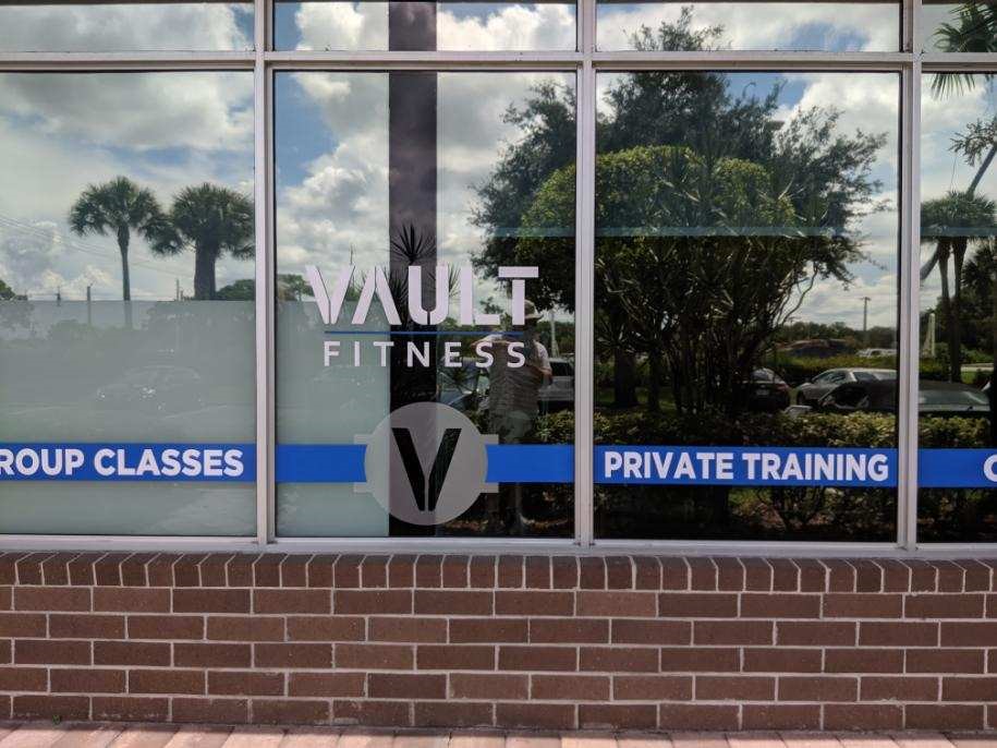 Glass window graphics with vinyl lettering for Vault Fitness