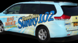 Graphics printed on the side of a van for a morning radio station, Sunny102.