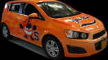 A graphic printed on the side of a car advertising Shelf Genie.
