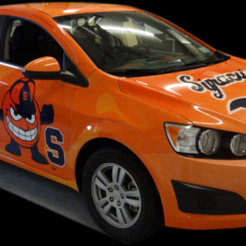 A graphic printed on the side of a car advertising Shelf Genie.