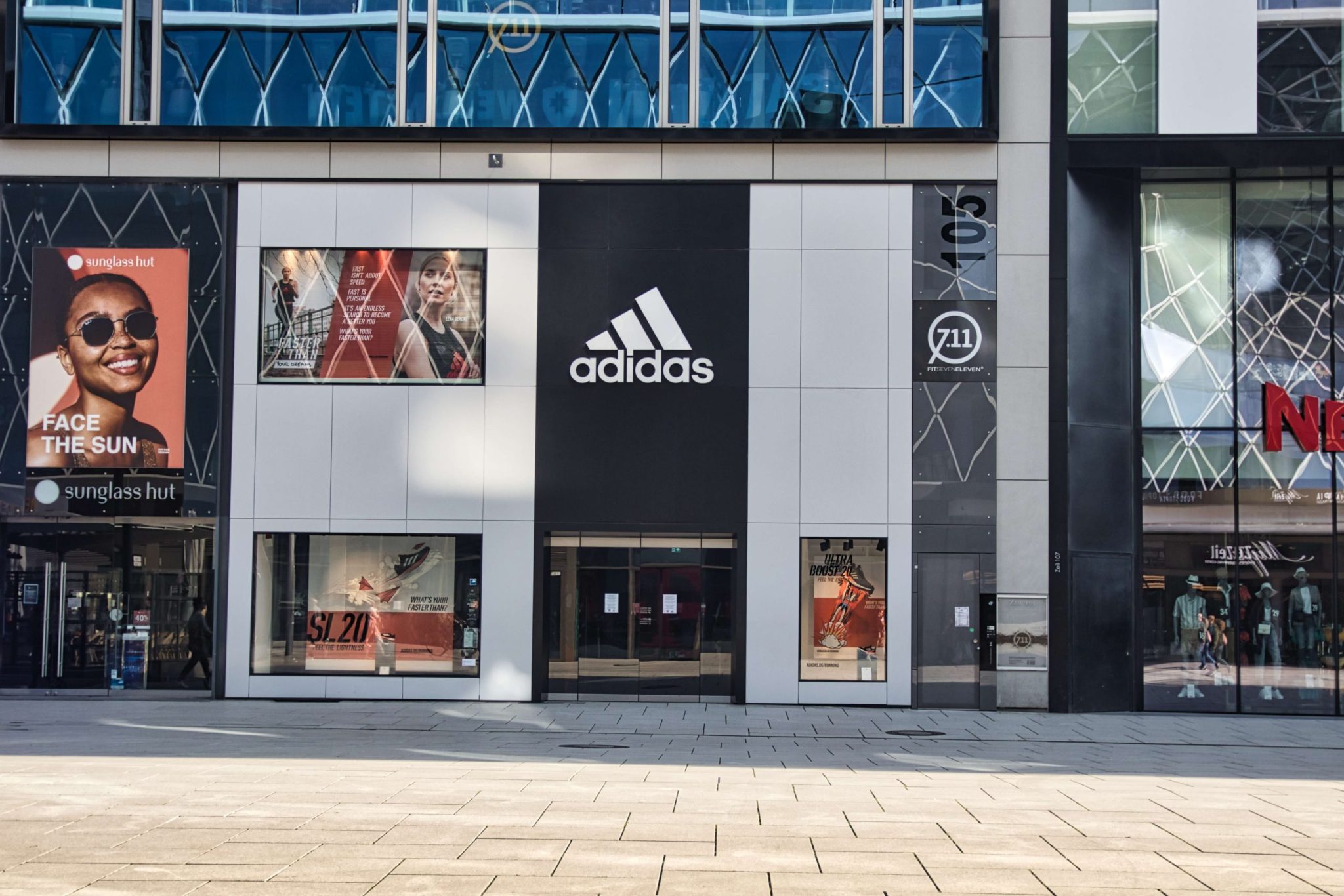 Advertising sign on building front showcasing logo