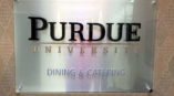 Wall sign for Purdue University Dining and Catering.