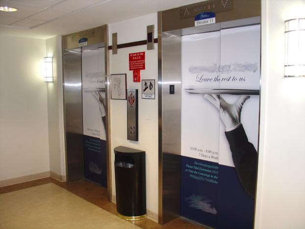 2 elevators with custom graphics on the doors