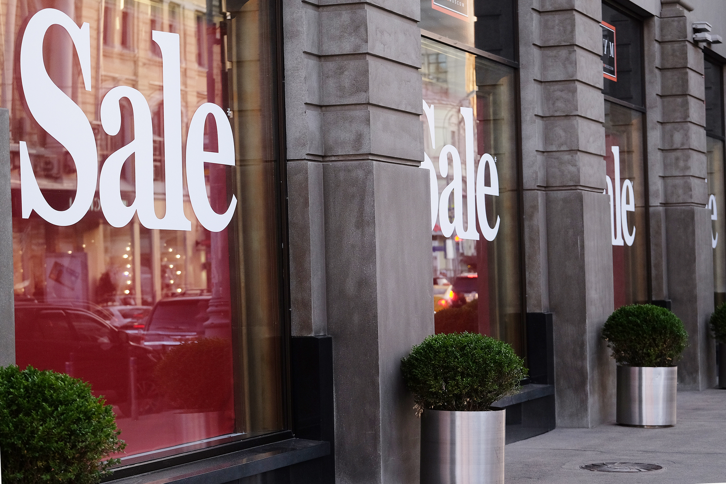 Large Window graphics that say sale on display in a window