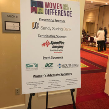 Women who make a difference sign with sponsors