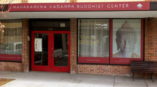 Banner and window signage for a Buddhist Center.