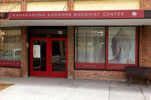 Banner and window signage for a Buddhist Center.