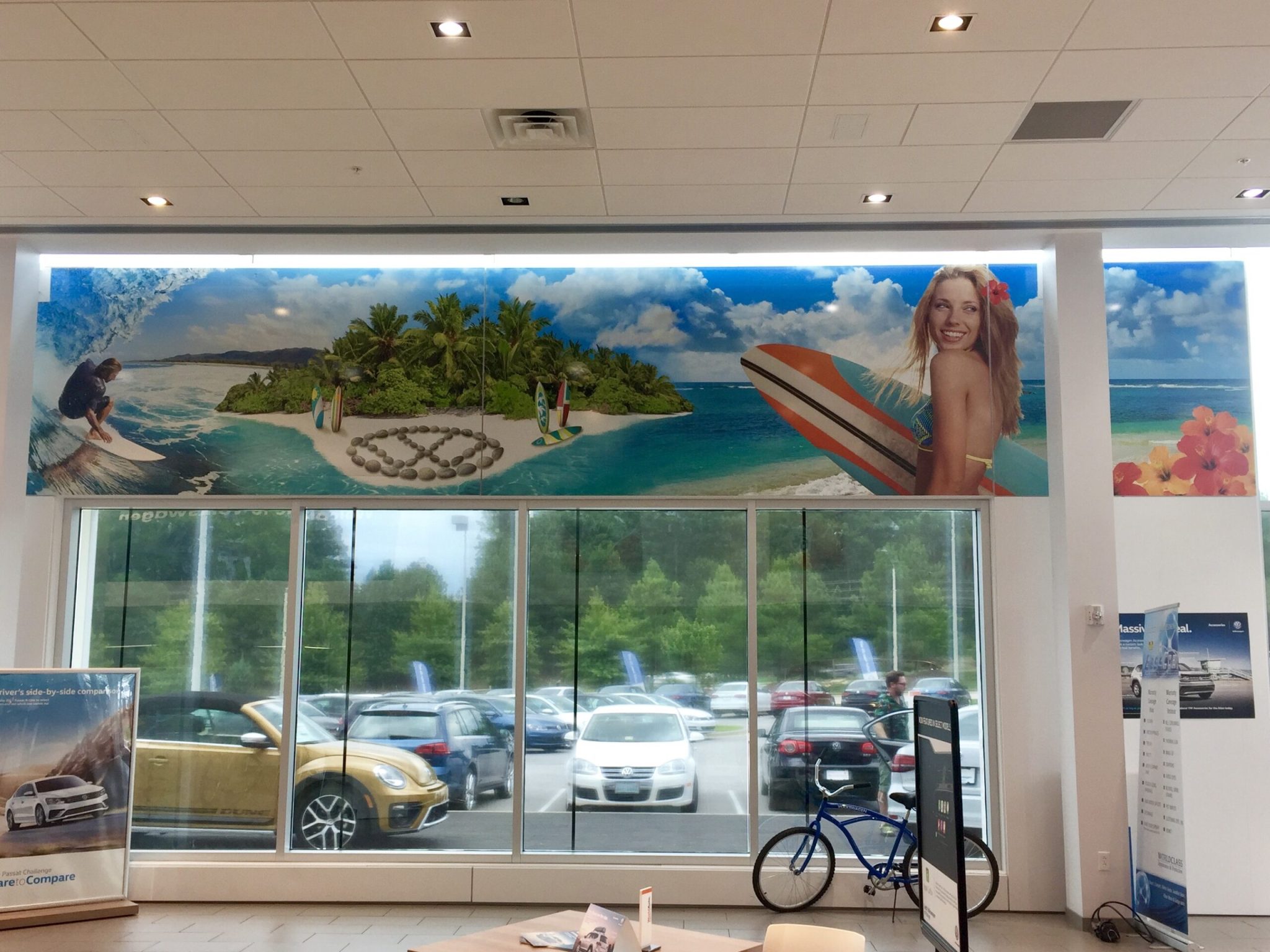 Beach scene printed mural in Volkswagen dealership  
