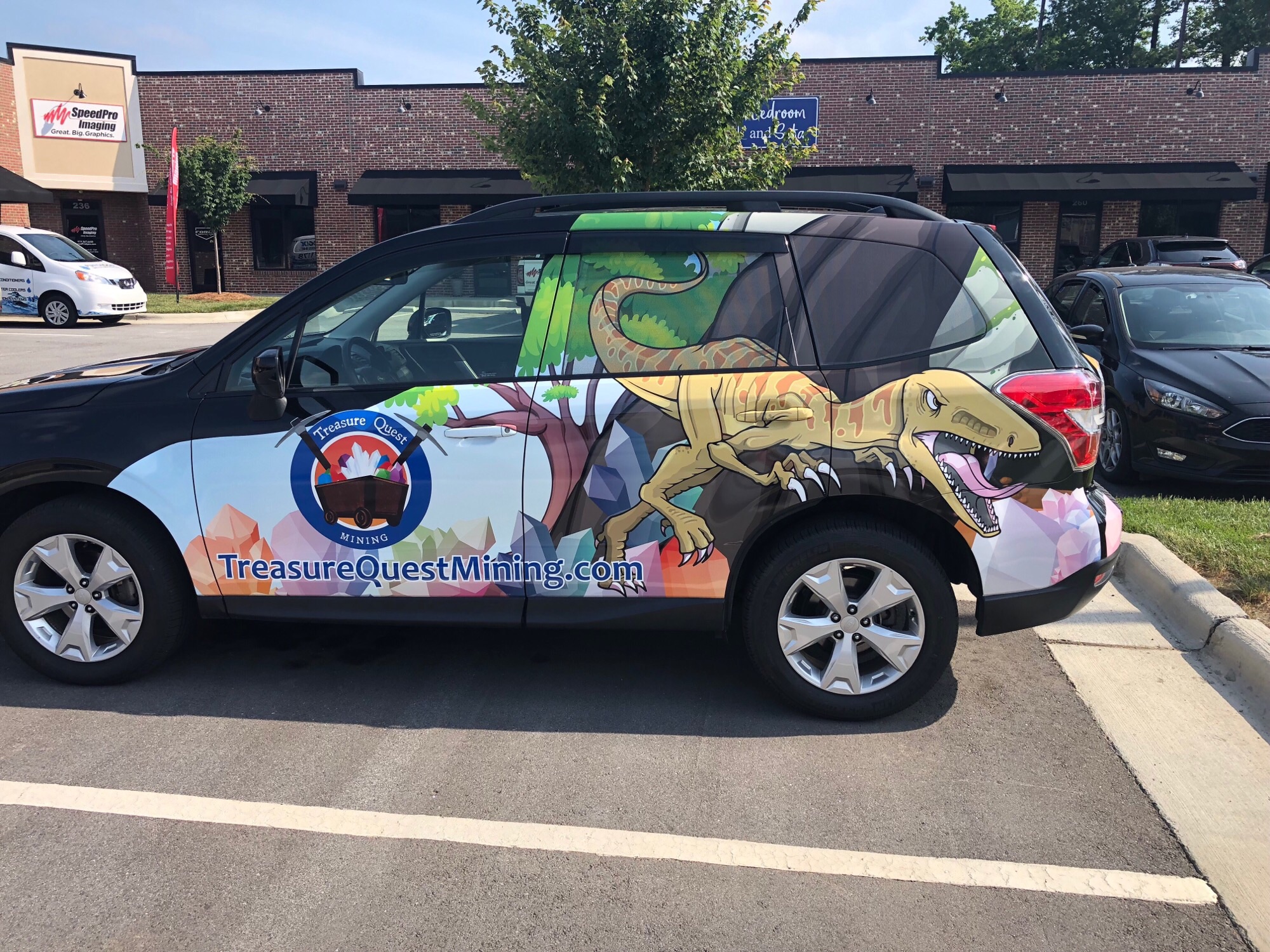 Treasure Quest advertisement wrap on vehicle