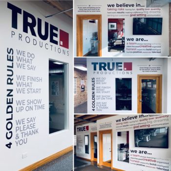 True productions office walls with custom graphics and writing. 