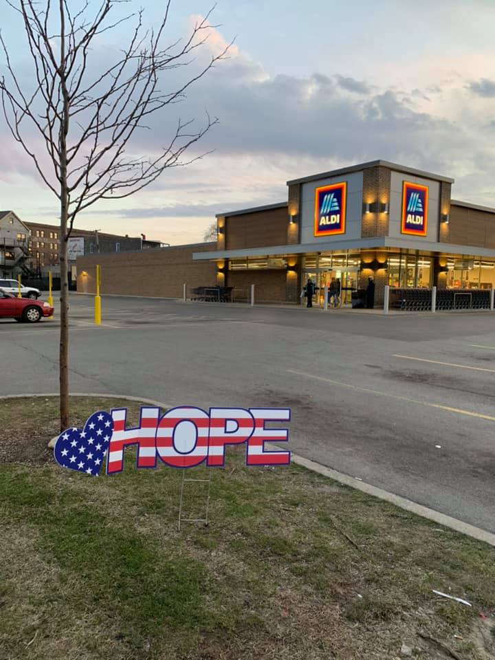 hope sign in front of aldi building