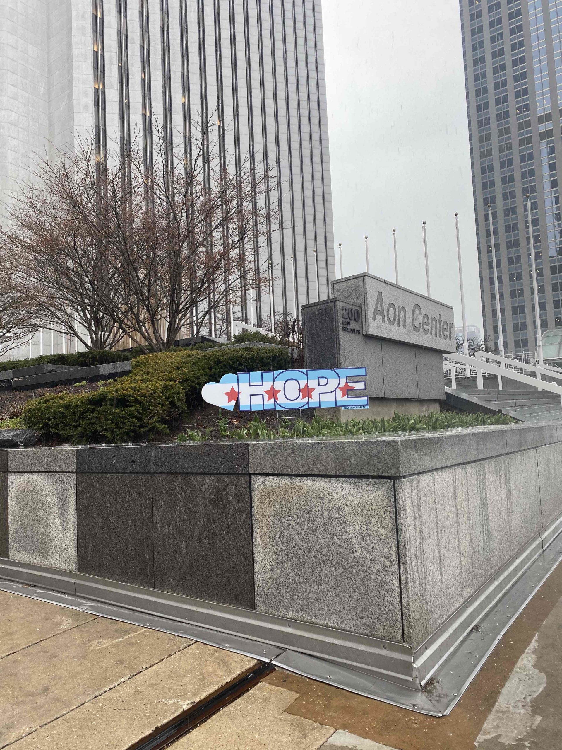 hope sign in front of the aon center building