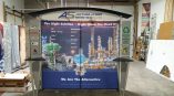 Retractable fabric tradeshow display with metal frame and counters in Chicago Downtown.