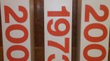 Three freestanding rectangular trade show displays with large red numbers in Chicago Downtown.