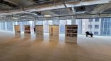 Five retractable vinyl banner stands displayed in an empty office space in Chicago Downtown.