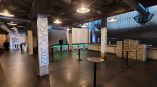 Indoor pillar wraps with event graphics on concrete columns in Chicago Downtown.