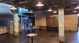 Two vertical pillar wraps with event graphics in an industrial space in Chicago Downtown.