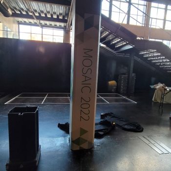 Fabric-wrapped column sign with geometric design in an industrial space in Chicago Downtown.