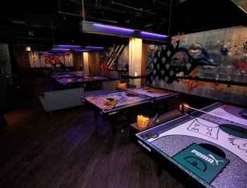 Indoor event space with custom printed ping pong table graphics and wall murals in Chicago Downtown.