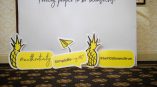 Foam board cutout signs with pineapples and speech bubbles in Chicago Downtown event.