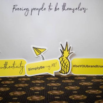 Foam board cutout signs with pineapples and speech bubbles in Chicago Downtown event.
