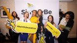 Large fabric backdrop banner with printed graphics and cutout props at an event in Chicago Downtown.