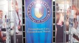 Curved fabric trade show display with metal frame and printed graphics in Chicago Downtown.