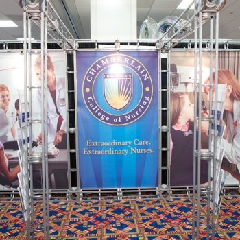 Curved fabric trade show display with metal frame and printed graphics in Chicago Downtown.