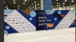 Large fabric trade show backdrop with printed graphics and logos in Chicago Downtown.