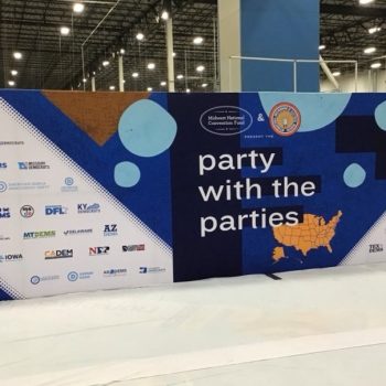 Large fabric trade show backdrop with printed graphics and logos in Chicago Downtown.