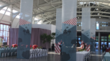 Tall fabric hanging banners with printed graphics in a large event space in Chicago Downtown.